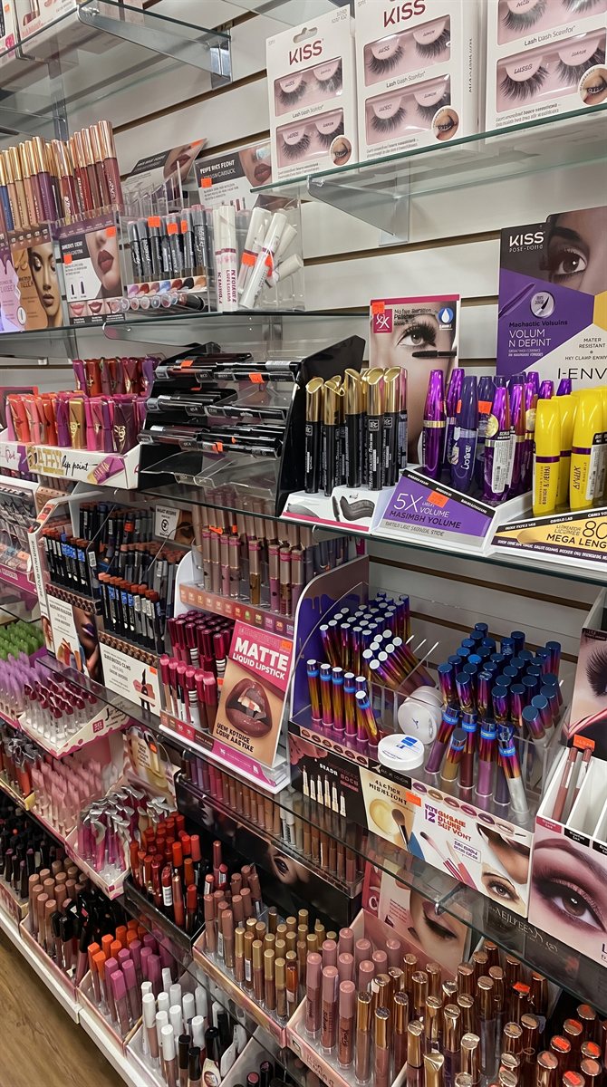 Shelves of lip color, lashes, and makeup inside the store